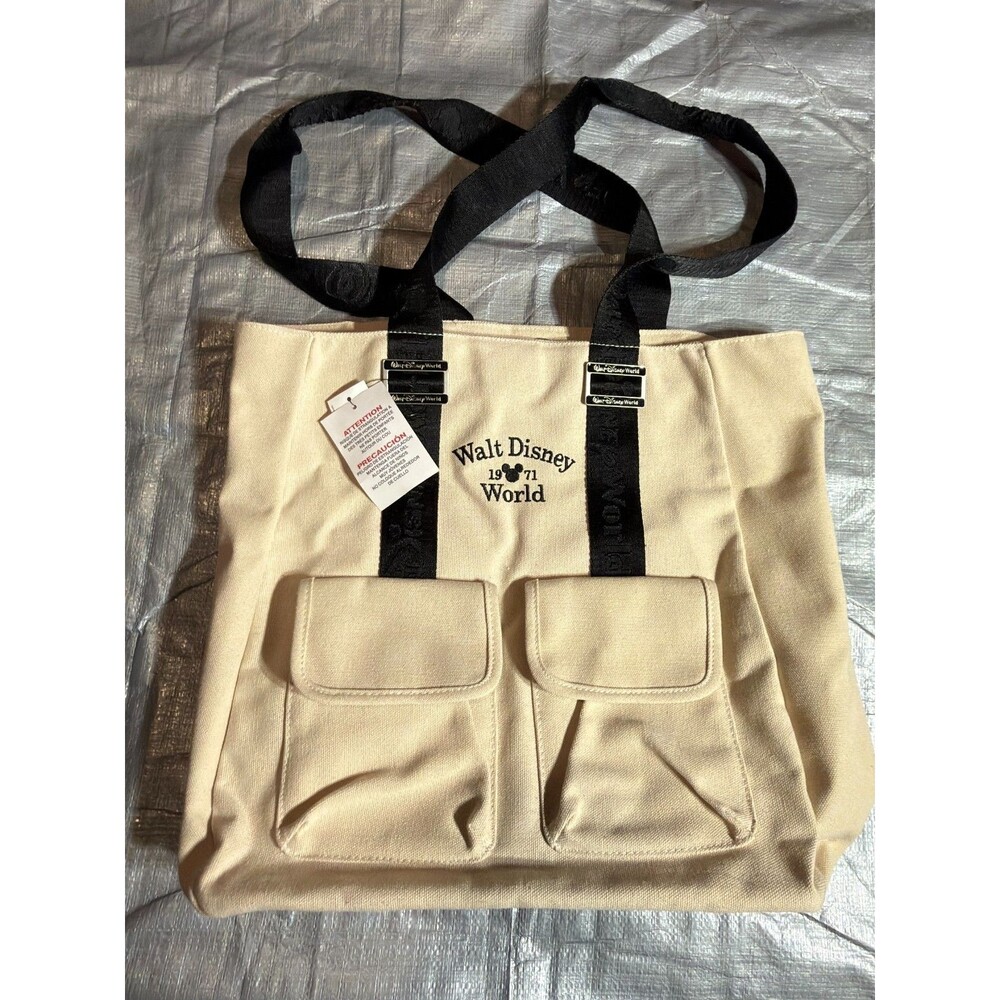 NWT Walt Disney World 1971 Cream Canvas Tote Bag Webbed Strap Flap Pockets